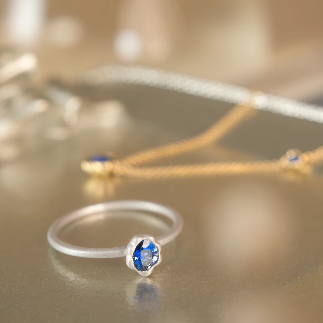 Melted gold blue sapphire ring